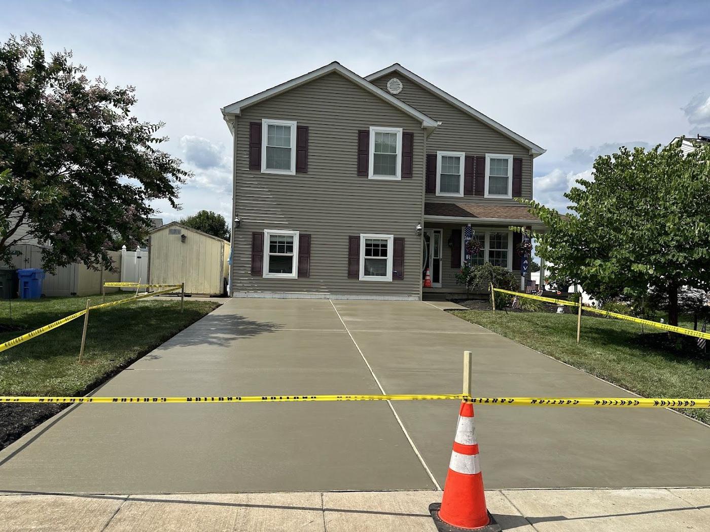 Wide finished concrete driveway with clean control joints